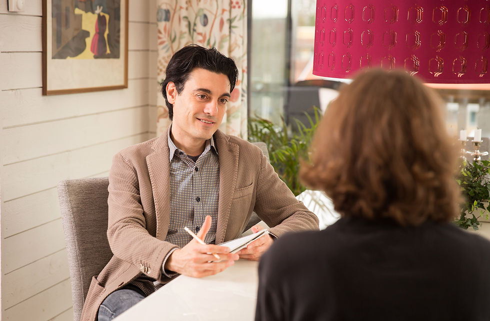 A man talking with a lady in the office.