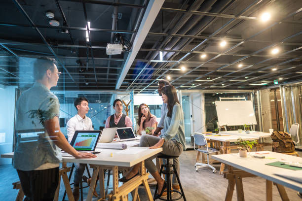 Group of young, modern people sitting on business meeting.