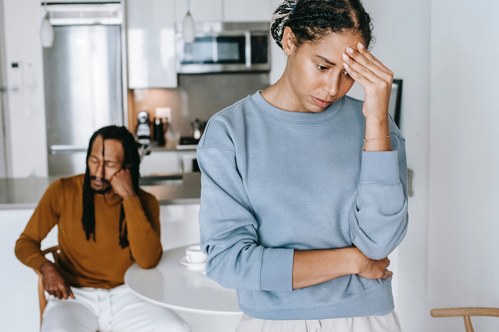 Unhappy couple arguing inside their house. 
