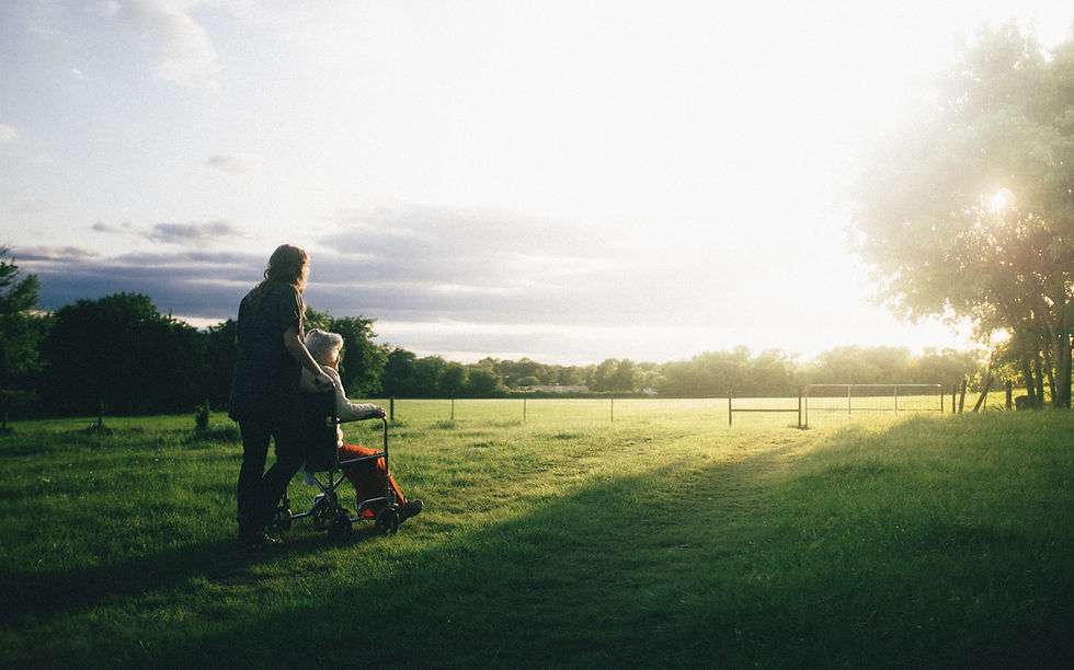 grandfather with his granddaughter playing outside.